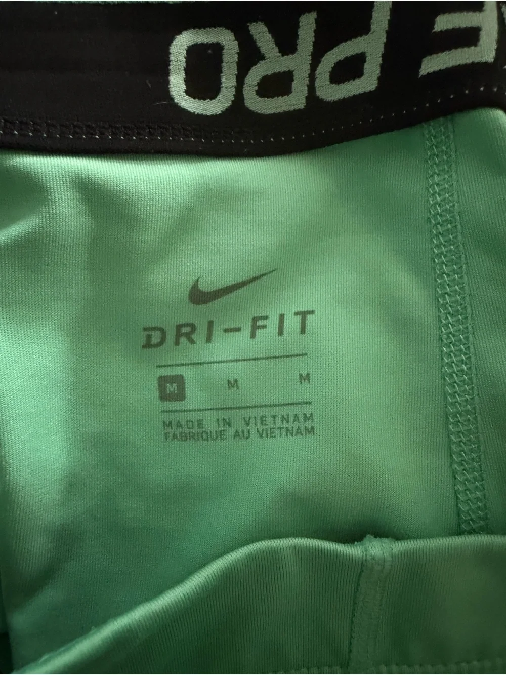 Nike Mint Green Athletic Compression Shorts with Black Swoosh